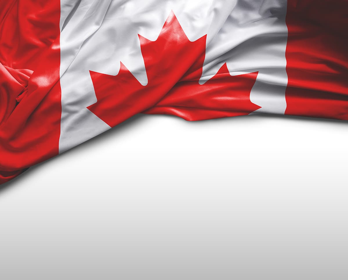 Canadian flag cloth pushed up t reveqal white background underneath